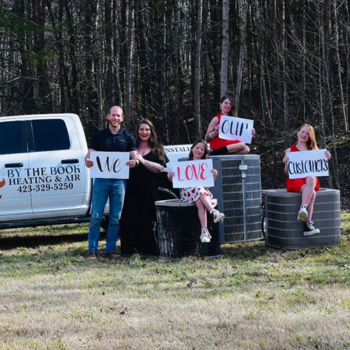 Family Holding Signs